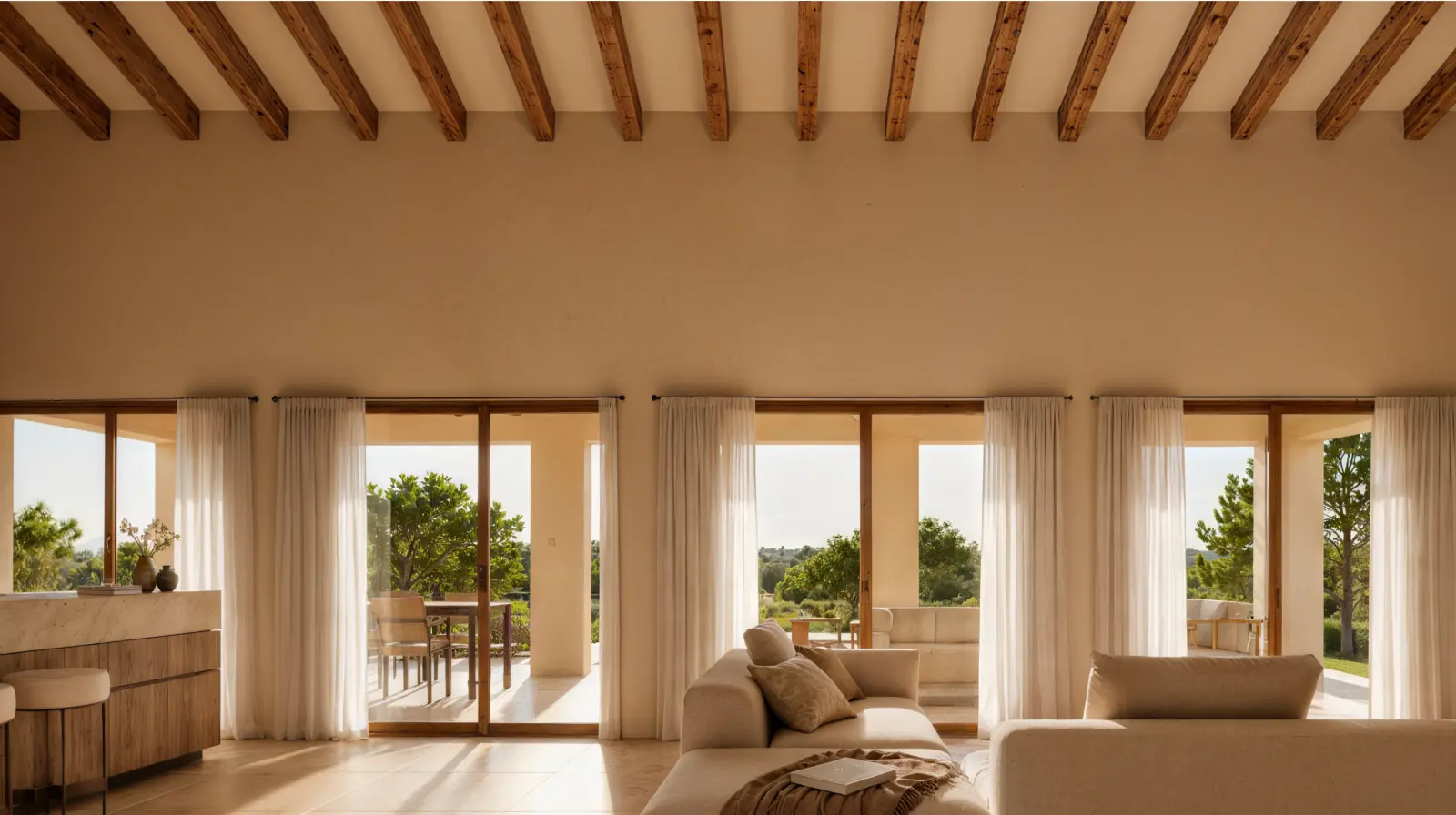 Living room opening onto the covered terrace through broad glass doors