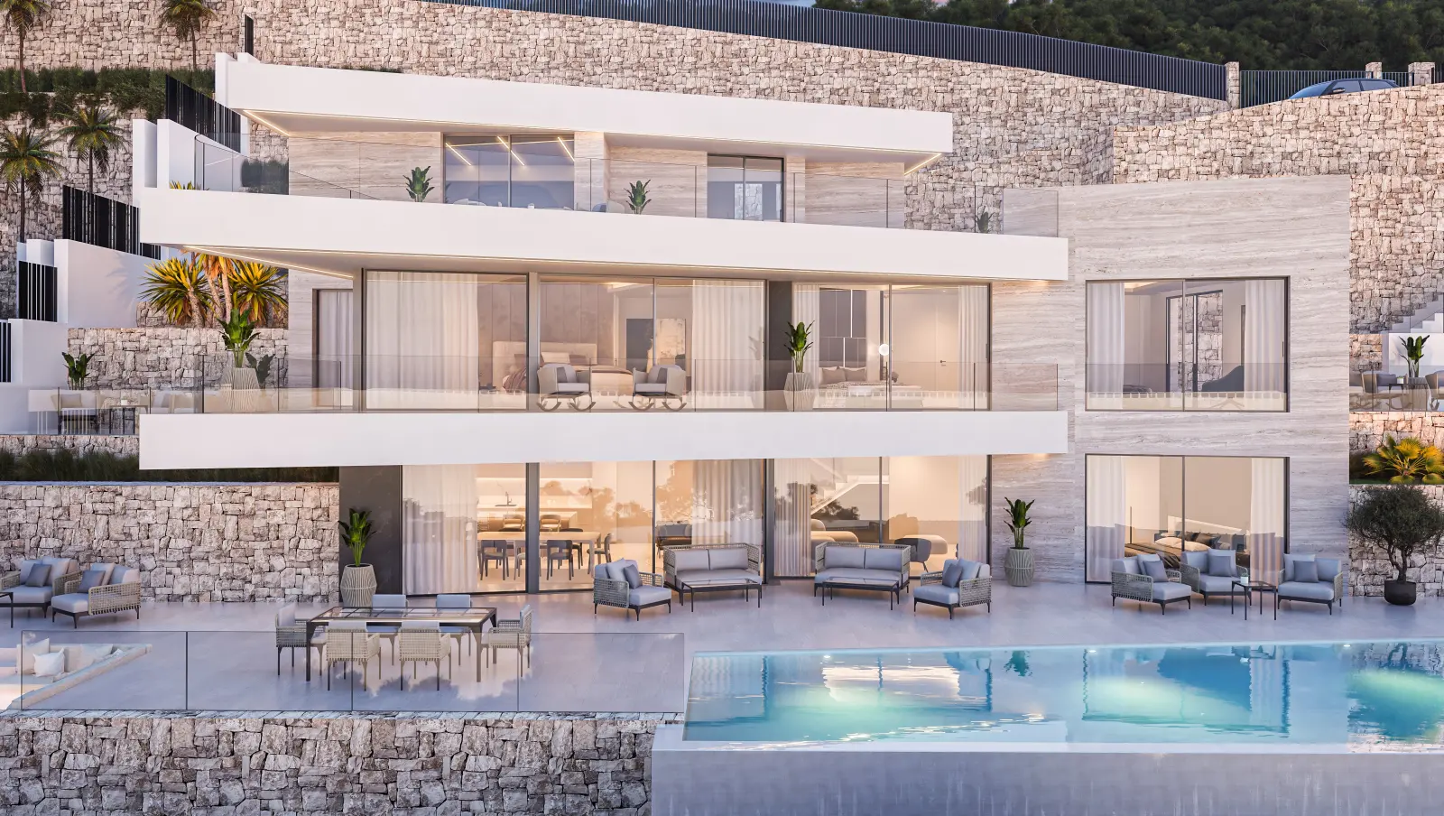 Villa façade viewed from the pool, with broad terraces on two levels