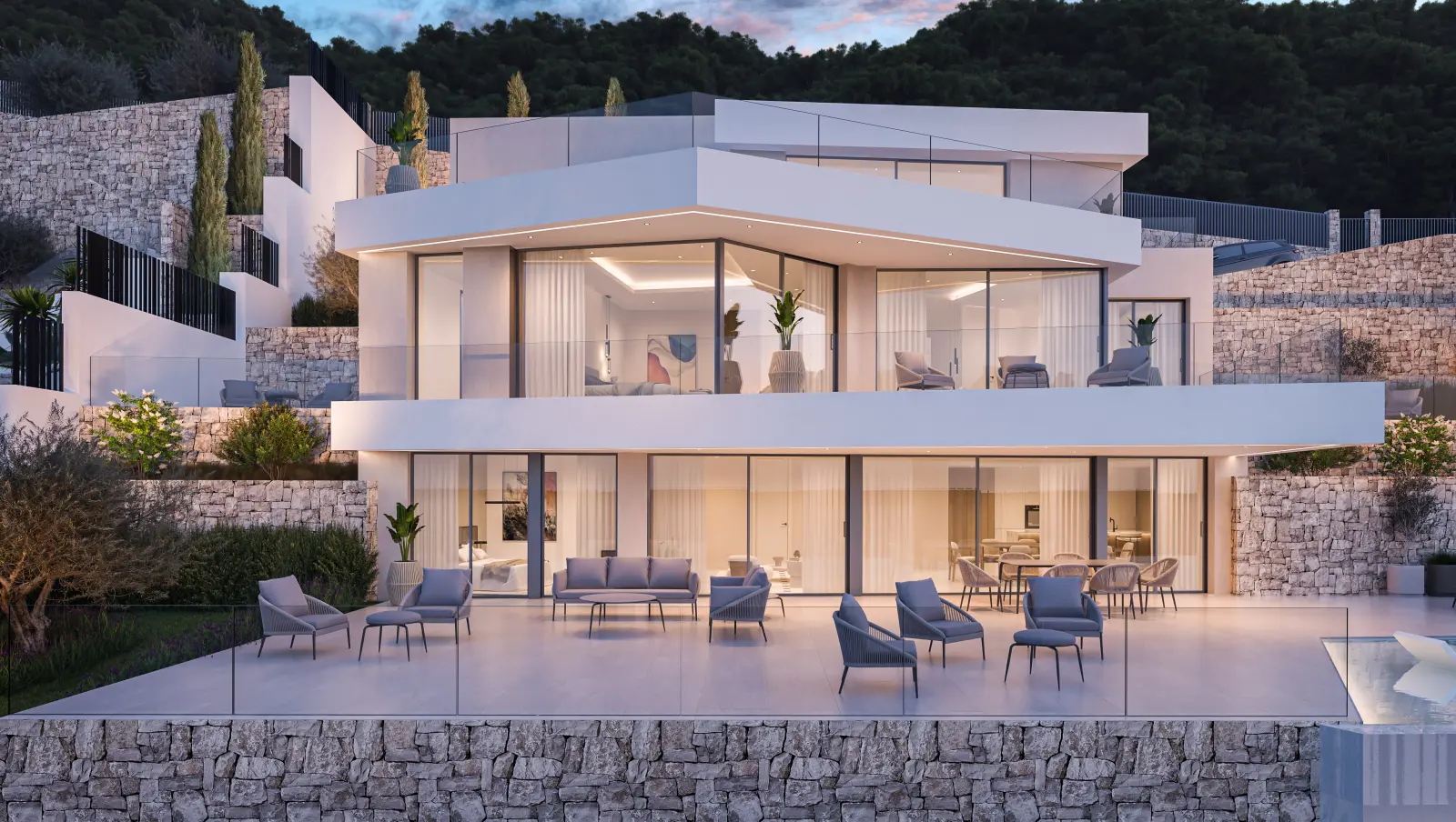 Villa exterior and terrace with floor-to-ceiling glazing beside the pool.